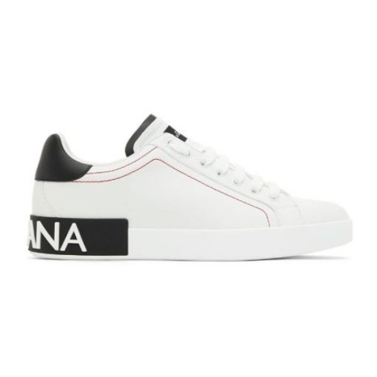 Side view of white Dolce & Gabbana Portofino leather trainer on a plain white background in white and black