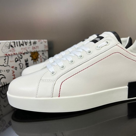 Close-up of the white leather toe box and lace closure on Dolce & Gabbana trainers in white and black