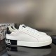 Outer side perspective of white Dolce & Gabbana Portofino trainers with red stitching in white and black