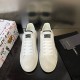 Top-down pair view of white and black Dolce & Gabbana Portofino leather trainers with laces