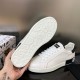Underside view showing the patterned sole and logo design of Dolce & Gabbana trainers in white and black