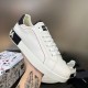Handheld angle of white Dolce & Gabbana Portofino leather trainer showing red side thread in white and black