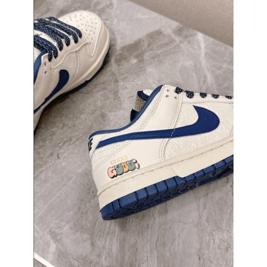 Gucci Low Top Leather Trainers In White And Blue Heel Graphic Detail Close-up of side graphic print on Gucci Low Top Leather Trainers In White And Blue