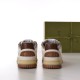 Rear view showing brown heel tabs and midsoles of white Gucci trainers