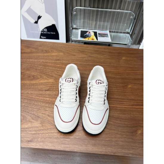 Top-down front view of pair of Gucci white and brown trainers