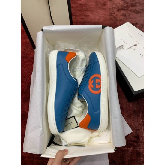 Blue Leather Trainers in Box in blue and orange Pair of blue leather trainers with orange accents presented inside shoe box
