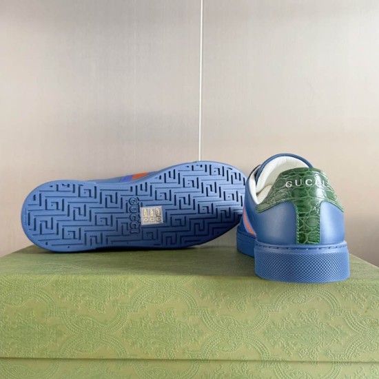 Gucci Ace Blue Trainer Heel and Sole View in blue and green Rear view of Gucci Ace blue trainer heel with green embossed leather tab next to blue patterned tread sole