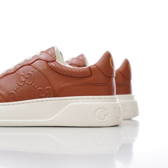 Rear three-quarter view showing heel panel and sole of Gucci brown trainer