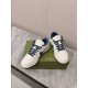 Gucci Low Top Leather Trainers In White And Blue Front View Front overhead view of Gucci Low Top Leather Trainers In White And Blue resting on green box
