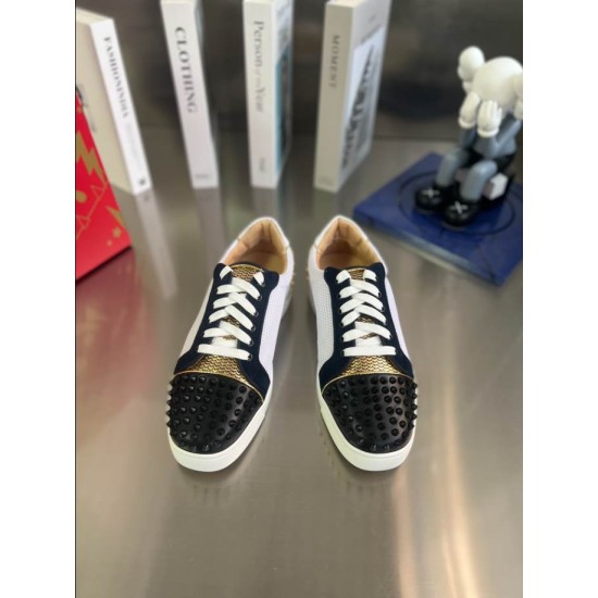 Christian Louboutin Low Top Mesh Spiked Trainers Top View in black and white Pair of Christian Louboutin Low Top Mesh Spiked Trainers in black, white, and gold viewed from above