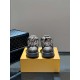 L Maxi Monogram Canvas Low Top Trainers in ebony brown front view Front view of L Maxi Monogram Canvas Low Top Trainers in ebony brown resting on a branded box