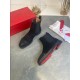 Christian Louboutin Men's Black Studded Suede Chelsea Boots Pair View Pair of Christian Louboutin Men's Black Studded Suede Chelsea Boots with one boot revealing the red outsole