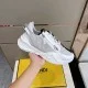 Profile View of White Fendi Flow Suede Trainer in white and grey Close-up profile view of the white suede and leather side panel with diagonal F logo on the sole in white and grey