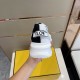 Heel View of Fendi Flow Trainer in white and grey Rear heel view of the trainer displaying the branded FLOW heel pull tab and white rubber sole in white and grey