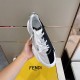 Handheld Top Angle View of Fendi Flow Trainer in white and grey Hand holding a single black and white Fendi Flow trainer from above in white and grey