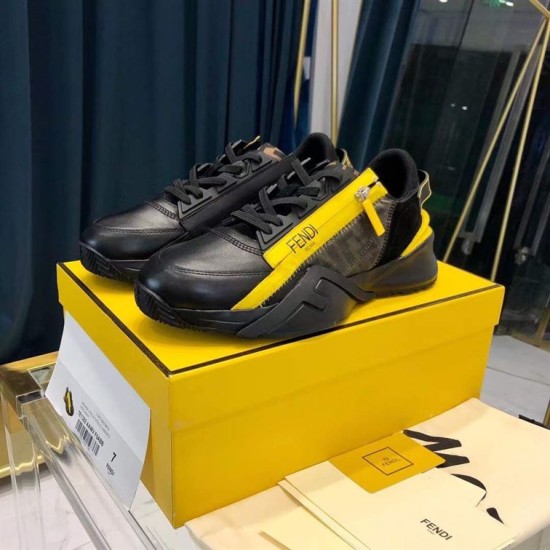 Fendi Flow Black Leather Trainers Three-Quarter View in black and yellow Three-quarter side view of Fendi Flow black leather low top trainers displaying side zip detail on box in black and yellow