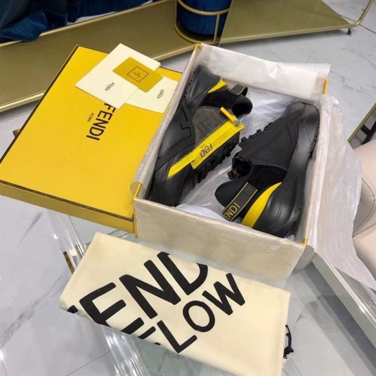 Fendi Flow Black Leather Trainers in Packaging Box in black and yellow Fendi Flow black leather low top trainers presented inside their open shoe box alongside dust bag in black and yellow