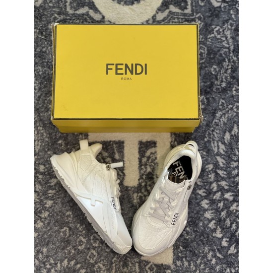 Top-Down View Fendi Flow White Trainers and Box Top-down view of white Fendi Flow trainers beside branded yellow box