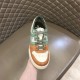 Fendi Match Suede Low Top Trainer Toe Detail in orange and green Front view of Fendi Match Suede Low Top Trainer held upright showing toe perforations in orange and green