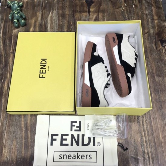 Fendi Match low-top trainers placed inside open yellow presentation shoe box with dust bag in black and off-white