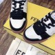 Detailed close-up of perforated off-white toe cap and black suede trim on Fendi trainer