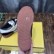 Bottom outsole view of Fendi Match trainer showing brown rubber tread pattern and logo in black and off-white