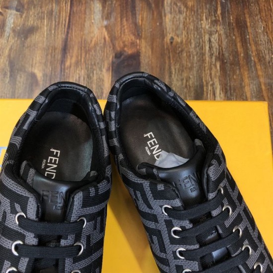 Fendi Tongue and Insole Detail in grey Close-up of leather tongue patches and inner soles on Fendi trainers in grey