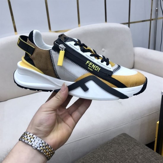 Close-up side view of the Fendi Flow trainer held up against a light background in multicolour and white