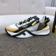 Medial side view of the Fendi Flow trainer resting on a textured fabric stool in multicolour and white