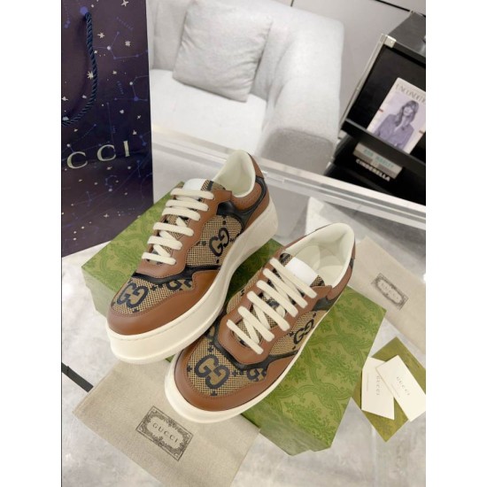 Gucci Brown Monogram Trainers Pair View in brown and green Pair of Gucci brown monogram canvas and leather trainers angled on box in brown and green