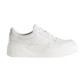Profile view of Gucci white leather low-top trainer featuring embossed monogram and thick rubber sole
