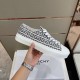 Lateral view of black and white Givenchy City trainer showing 4G jacquard pattern and thick sole