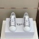 Top-down view of both black and white Givenchy City 4G jacquard trainers on a shoe box