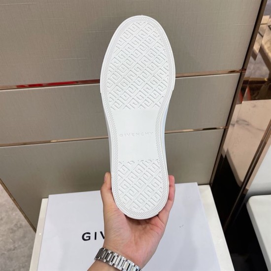 Bottom view of white rubber sole on Givenchy City trainer featuring geometric tread in black and white