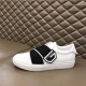 Givenchy White Leather Trainer Outer View in white and black Lateral side view of Givenchy white trainer resting on leather surface in white and black