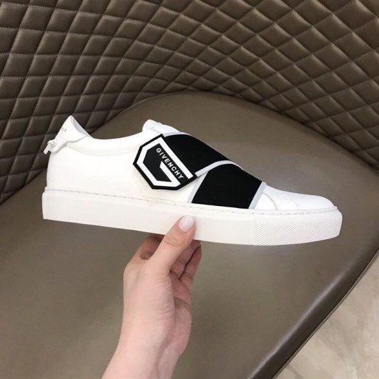 Givenchy White Leather Trainer Lateral Side View in white and black Hand holding Givenchy white trainer showing outer profile and black logo detail
