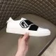 Givenchy White Leather Trainer Lateral Side View in white and black Hand holding Givenchy white trainer showing outer profile and black logo detail