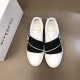Givenchy White Leather Trainers Overhead View in white and black Top-down view of Givenchy white leather trainers showing black elasticated straps and insoles
