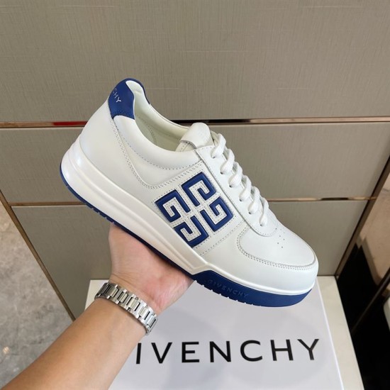 Givenchy G4 Low Top Leather Trainer In White And Blue held at an angle showing side logo