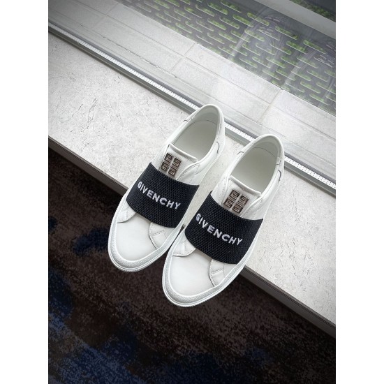 Givenchy Elastic Band Trainers Top View in white and black Pair of Givenchy white trainers with black logo elastic bands on a window ledge