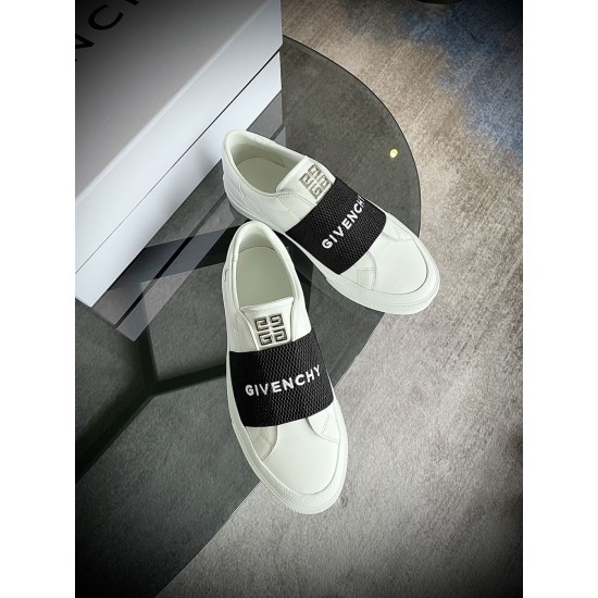 Givenchy White Trainers Overhead View in white and black Overhead angle of Givenchy white leather trainers with metallic tongue hardware in white and black
