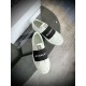 Givenchy White Trainers Overhead View in white and black Overhead angle of Givenchy white leather trainers with metallic tongue hardware in white and black