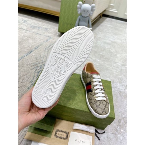 Gucci Ace GG Supreme Canvas Web Stripe Trainers Sole Tread View in beige and brown Underside tread pattern of white rubber sole on Gucci Ace GG Supreme Canvas Web Stripe Trainers in beige and brown