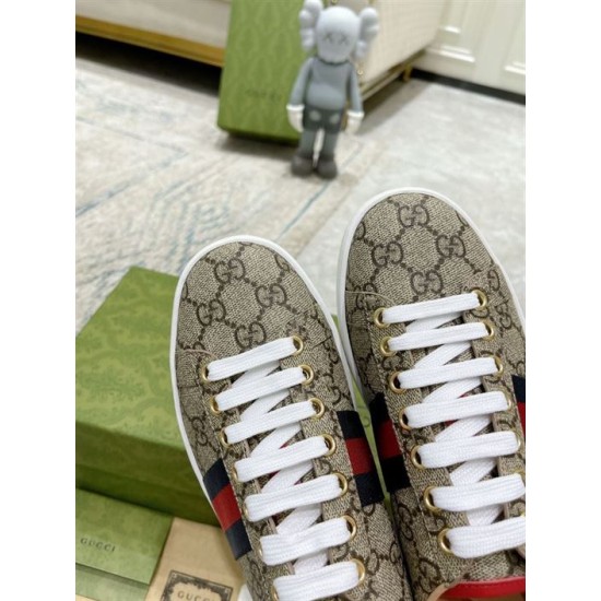 Gucci Ace GG Supreme Canvas Web Stripe Trainers Toe Detail in beige and brown Close-up of toe box and lacing system on Gucci Ace GG Supreme Canvas Web Stripe Trainers in beige and brown