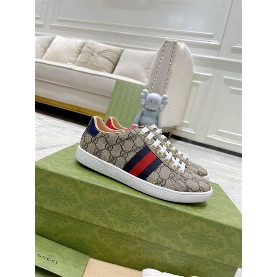 Gucci Ace GG Supreme Canvas Web Stripe Trainers Box Display in beige and brown Gucci Ace GG Supreme Canvas Web Stripe Trainers resting on branded green shoe box in beige and brown