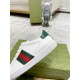 Close-up of green textured heel and side stripe on Gucci Ace Leather Trainers in white