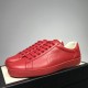 Gucci Ace Red Leather Trainers Pair View in red and white Pair of Gucci Ace Red Leather Trainers in three-quarter front view in red and white