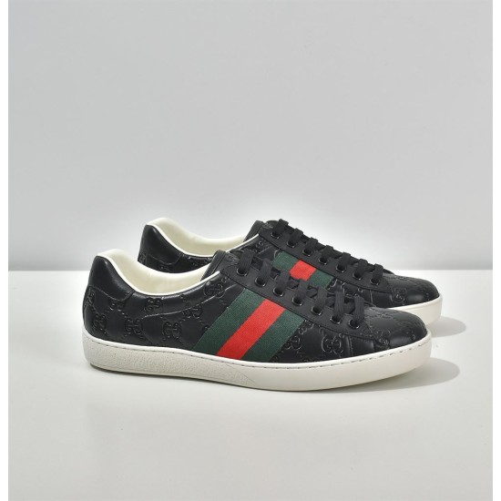 Gucci Ace Embossed Leather Low Top Trainers Black Three-Quarter Angle Three-quarter side angle of Gucci Ace Embossed Leather Low Top Trainers Black