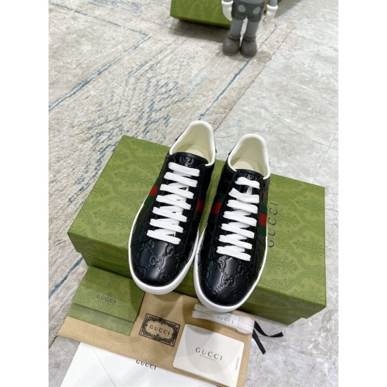 Gucci Ace Black Trainers Top-Down View in black and red Pair of Gucci Ace black embossed trainers viewed from directly above in black and red