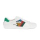 Profile view of white Gucci Ace x Disney Donald Duck leather trainer featuring web stripes